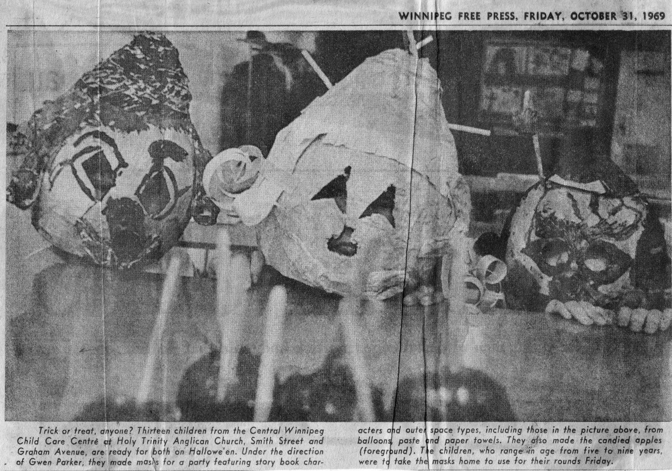 Photo of three children in Halloween masks